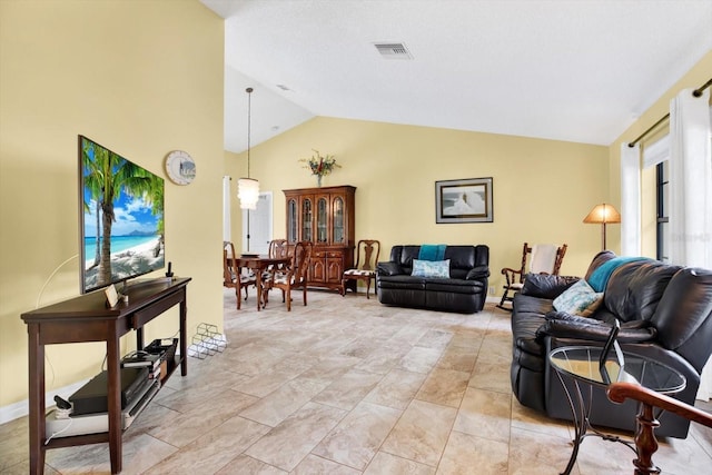 living room featuring vaulted ceiling