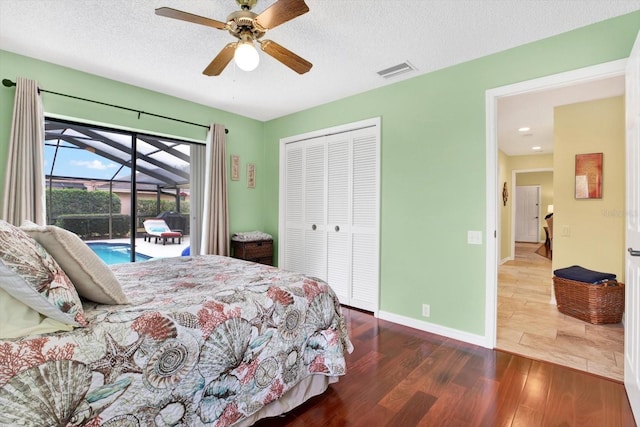 bedroom featuring a textured ceiling, a closet, hardwood / wood-style flooring, ceiling fan, and access to exterior