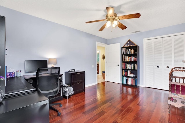 office area with ceiling fan and dark hardwood / wood-style floors