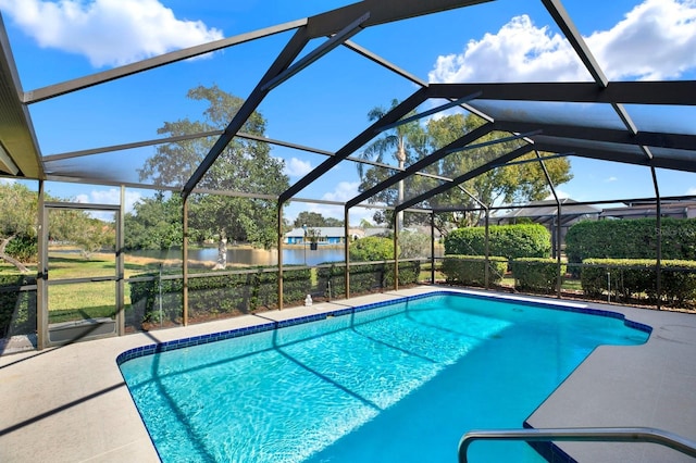 view of pool with a water view, a patio, and a lanai