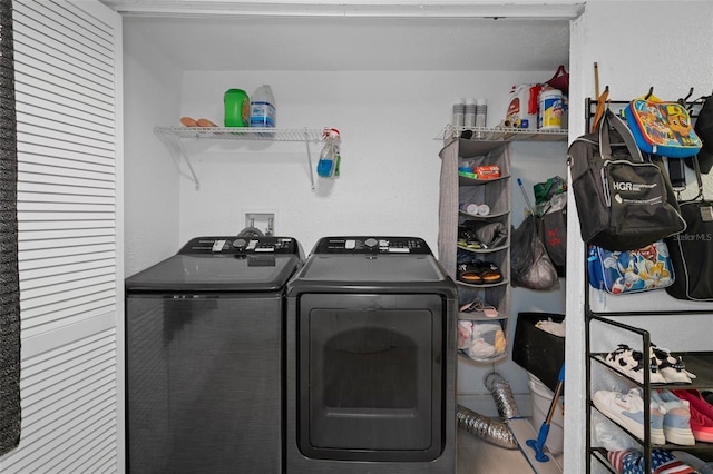 laundry room with independent washer and dryer