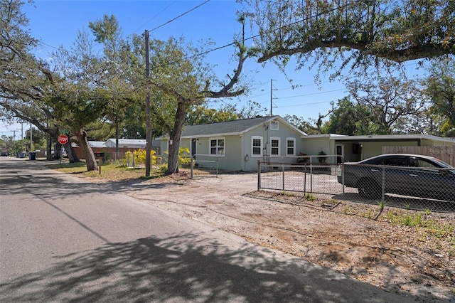 single story home featuring a carport