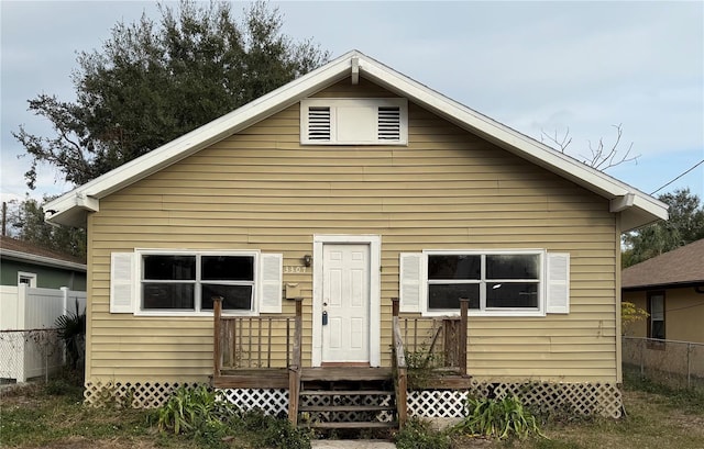 view of front of home with fence