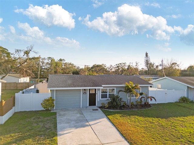 ranch-style home featuring a garage and a front yard