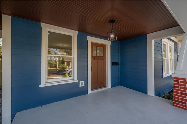 property entrance with covered porch