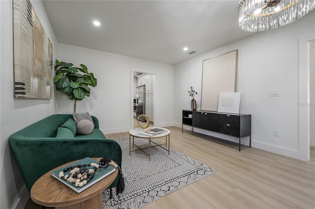 living area with hardwood / wood-style floors