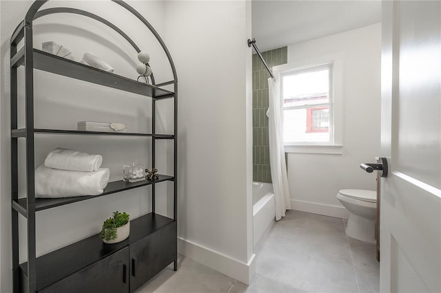 bathroom with shower / bath combination with curtain and toilet