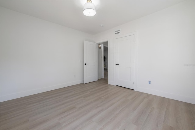 unfurnished room featuring light hardwood / wood-style flooring