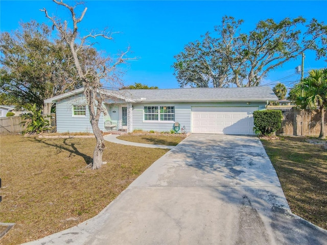 single story home with a garage and a front lawn