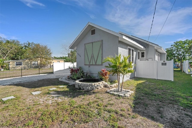 view of home's exterior featuring a lawn