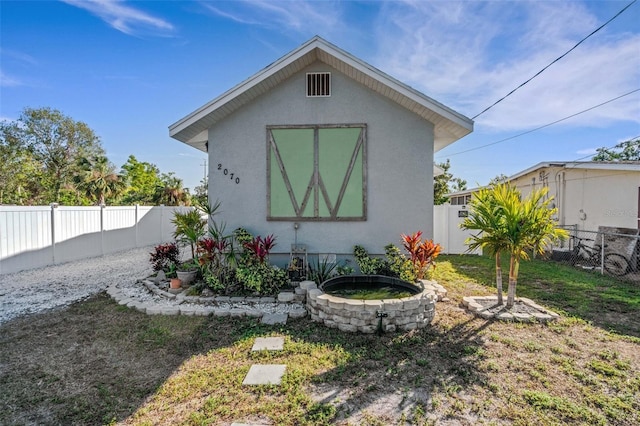 exterior space with a yard and an outdoor structure