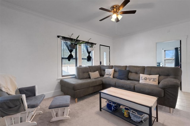 living room featuring crown molding, a healthy amount of sunlight, and ceiling fan