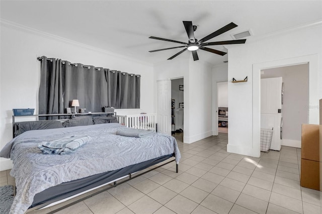 bedroom with ceiling fan, ornamental molding, and light tile patterned floors