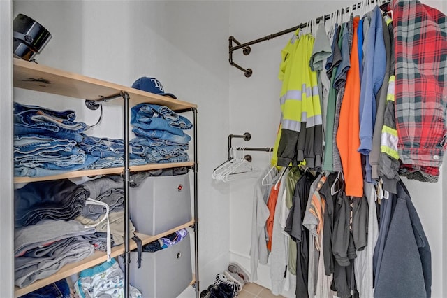 walk in closet with tile patterned flooring