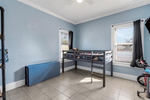 bedroom with crown molding, light tile patterned floors, and ceiling fan