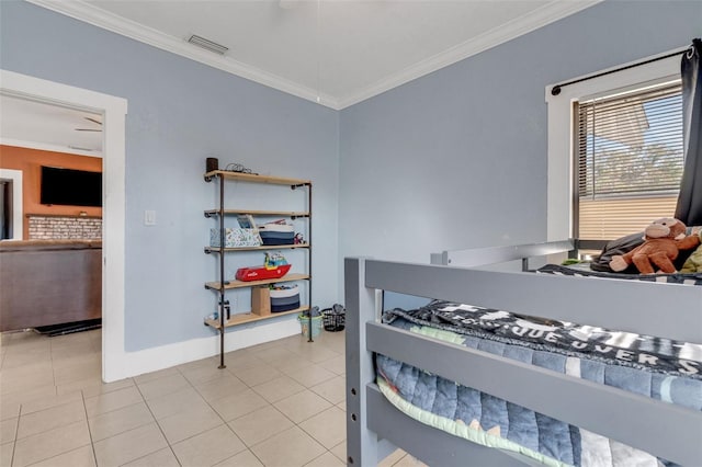 bedroom with light tile patterned floors and ornamental molding