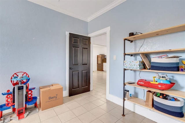 interior space with crown molding and light tile patterned flooring