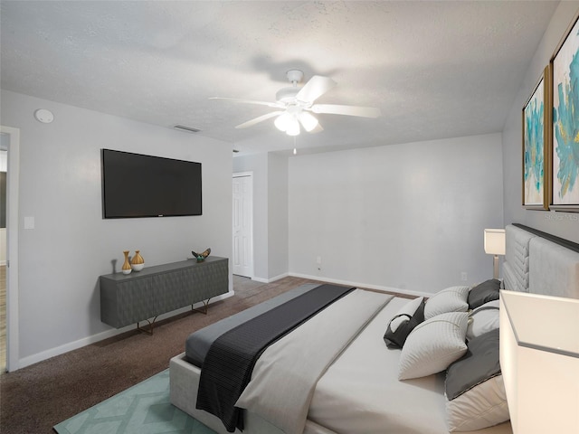 carpeted bedroom featuring ceiling fan, a closet, and a textured ceiling