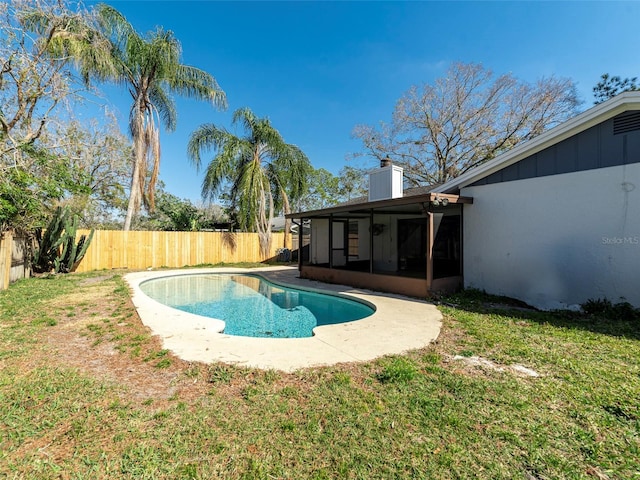 view of pool featuring a yard and a sunroom