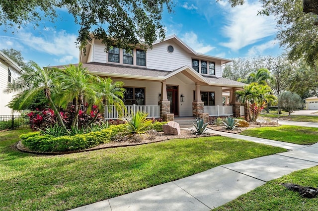 view of front of property featuring a porch and a front yard