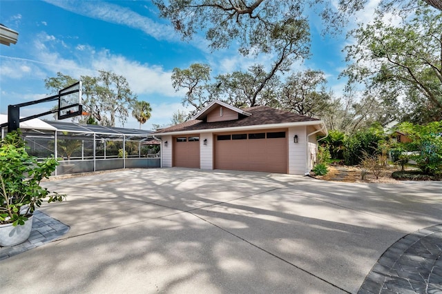 exterior space with a garage and a lanai