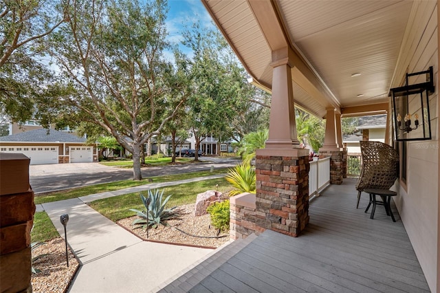 wooden terrace with a porch