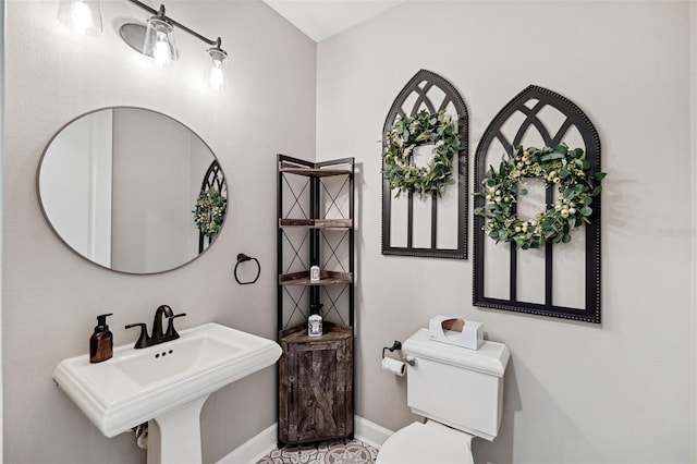 bathroom with toilet and sink