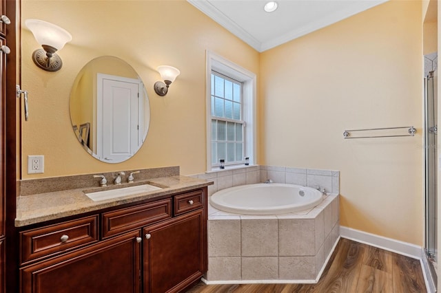 bathroom with vanity, wood-type flooring, ornamental molding, and independent shower and bath