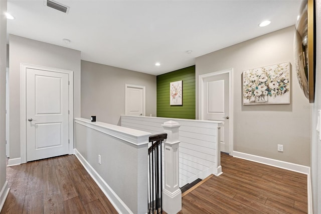 hall with dark hardwood / wood-style floors