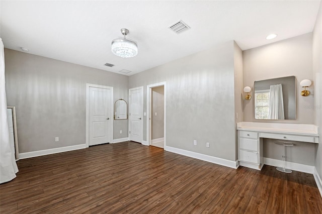 unfurnished bedroom with dark hardwood / wood-style floors