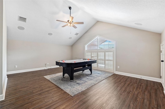 playroom featuring vaulted ceiling, ceiling fan, a textured ceiling, and dark hardwood / wood-style flooring