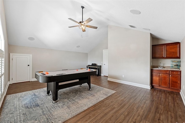 playroom featuring dark hardwood / wood-style flooring, sink, lofted ceiling, and ceiling fan