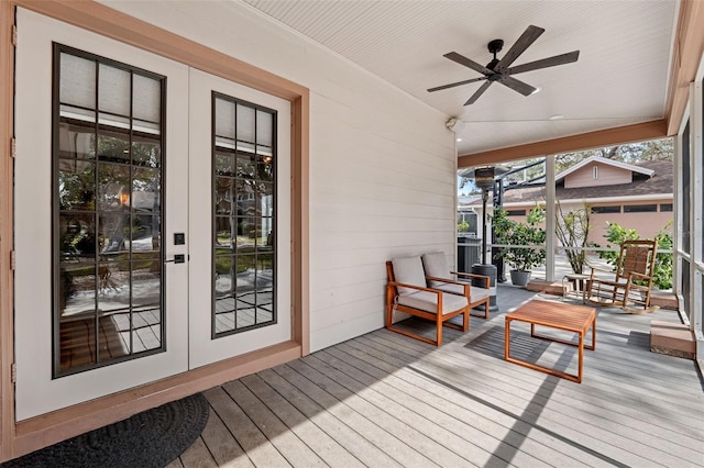 deck featuring ceiling fan and french doors