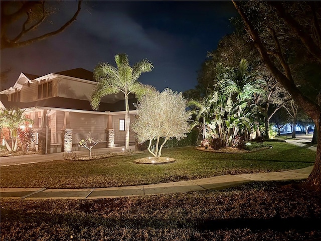 view of home's community with a yard