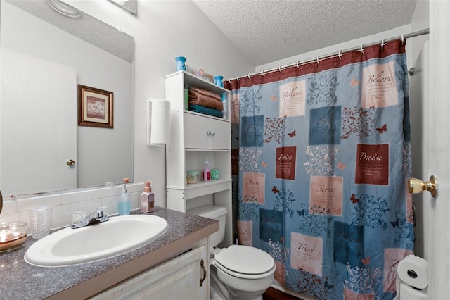 bathroom featuring a shower with shower curtain, vanity, a textured ceiling, decorative backsplash, and toilet