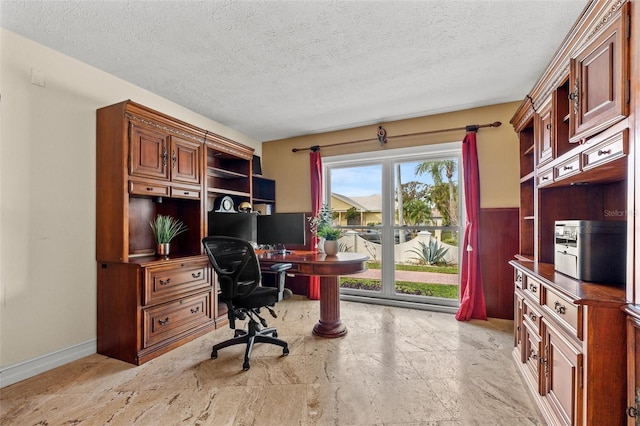 office area with a textured ceiling