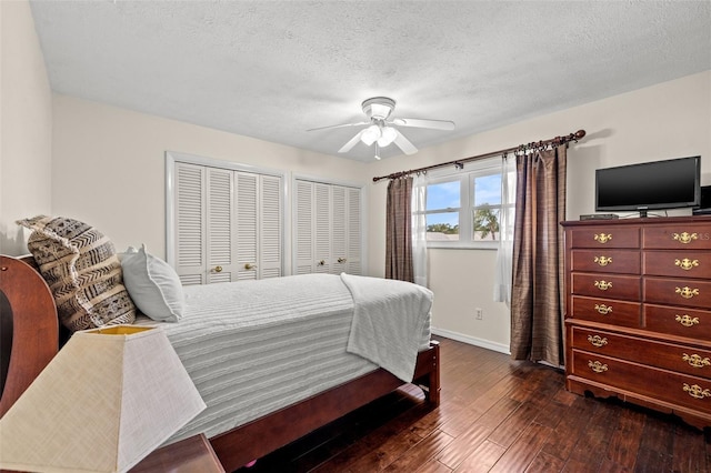 bedroom with dark hardwood / wood-style flooring, ceiling fan, and a textured ceiling