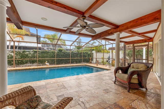 view of pool with a lanai, a patio area, and ceiling fan