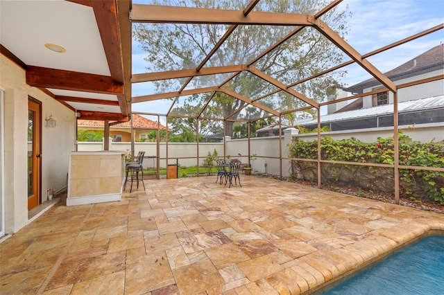 view of patio with a lanai and a fenced in pool