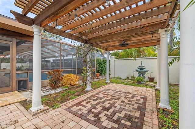 view of patio featuring a pergola and glass enclosure