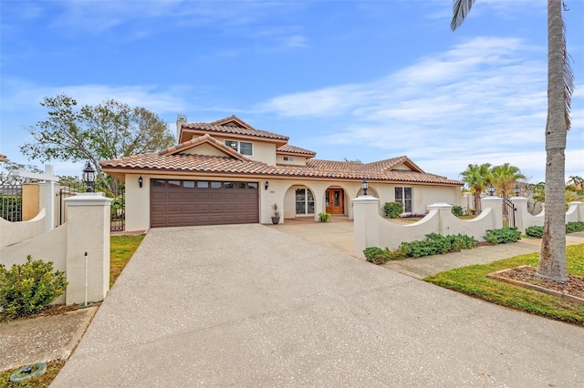 mediterranean / spanish-style house with a garage