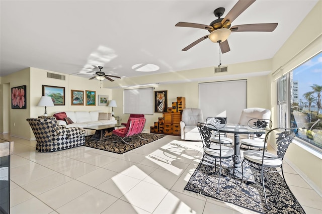 tiled living room featuring ceiling fan