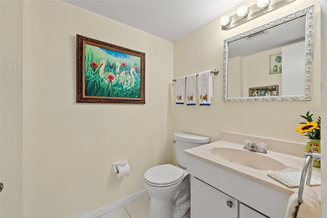 bathroom with vanity, toilet, and tile patterned flooring