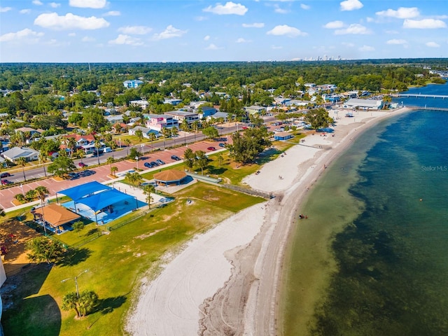 birds eye view of property featuring a view of the beach and a water view