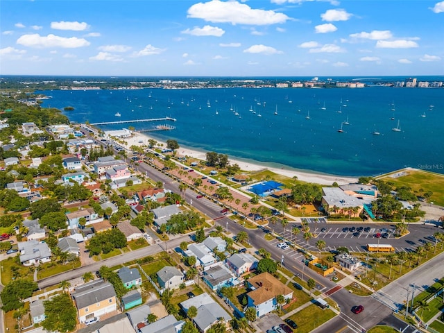 drone / aerial view featuring a water view and a beach view