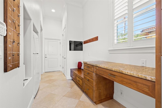 bathroom with crown molding and tile patterned floors