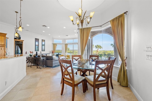 tiled dining room with a notable chandelier and ornamental molding