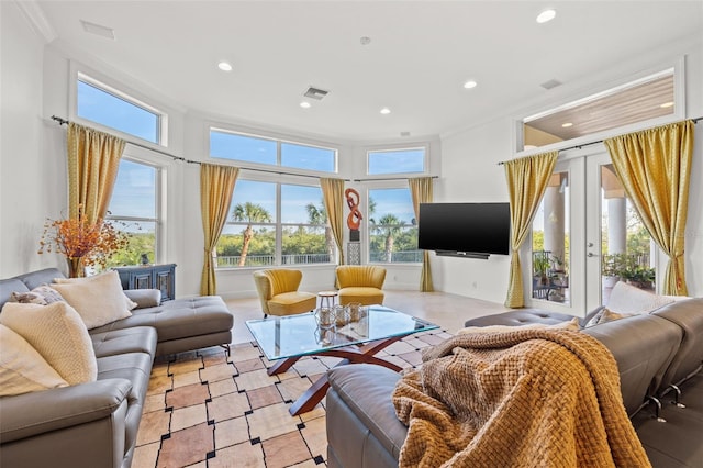 living room with crown molding and french doors