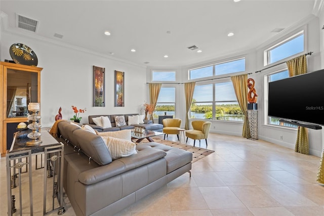 living room featuring ornamental molding and light tile patterned floors