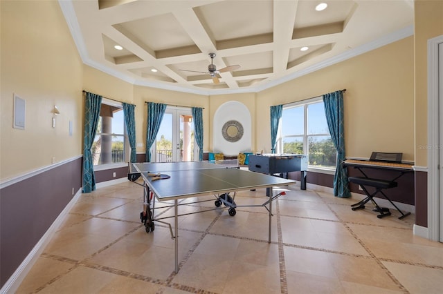 rec room featuring plenty of natural light, coffered ceiling, ceiling fan, and a towering ceiling